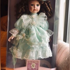 New in box Collectible Memories Hand Crafted Porcelain Doll. Kelly. Approx 16”